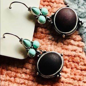 Intricate etching and leather bound earrings from Macy’s
